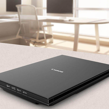 Scanner Canon Lide 300, dimensiune A4, tip flatbed, viteza scanare 2,2 msec./linie (300dpi), 14.8 msec./linie (2400 dpi), rezolutie optica 2400 x 4800dpi, senzor CIS, 4 butoane (PDF, AUTOSCAN, COPY, SEND), interfata: USB 2.0.
