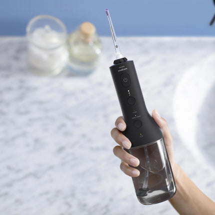 Irigator bucal PHILIPS Sonicare Cordless Power Flosser 3000 HX3826/33, Tehnologie QuadStream, Portabil, 2 moduri de curatare, 3 niveluri de intensitate, 2 x capete de curatare si 1 x husa transport, Negru, L x A x I (mm) 92x134x247